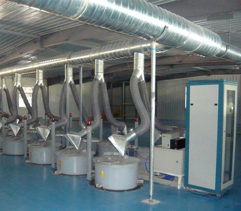 Automatic batching system with industrial tanks and ventilation hoods.